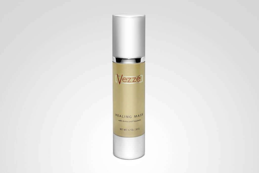 Vezzé Healing Mask bottle with arnica and squalane, 1.7 oz size, silver cap, on a white background.