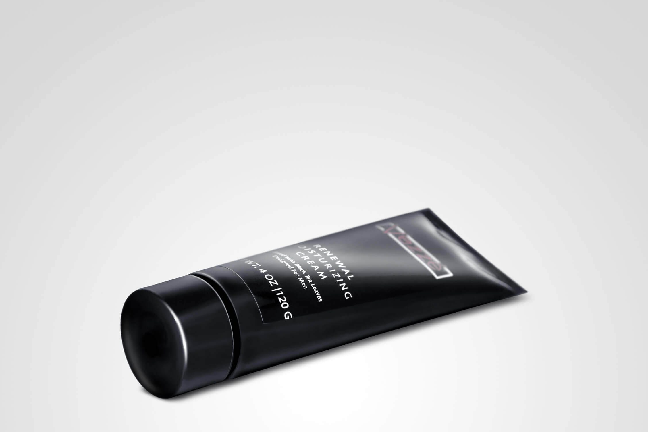 Black tube of Renewal Moisturizing Cream 2 with sleek design on light gray background, 4oz skincare product.